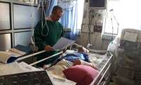 عیادت رئیس دانشگاه علوم پزشکی از همکار قطع نخاعی شده در بیمارستان22آبان لاهیجان